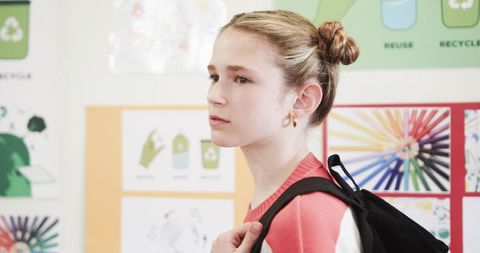 Young student pondering environmental conservation at school