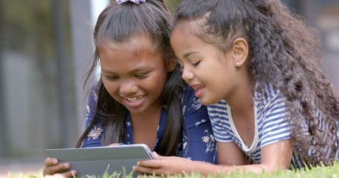 Children Using Tablet Outdoors for Learning and Fun
