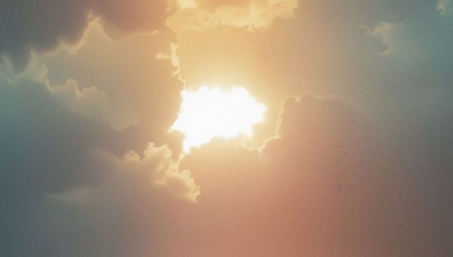 Brilliant Sunbeams Radiating Through Majestic Cloudscape