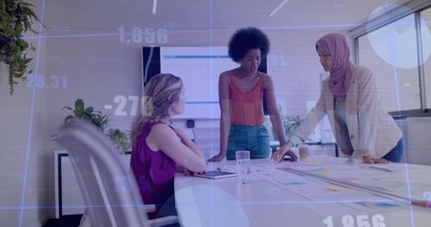 Diverse Business Colleagues Analyzing Financial Data in Office