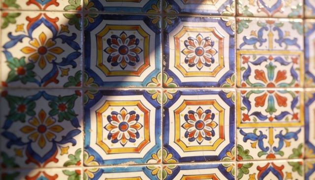 Colorful glazed ceramic tiles with octagonal rosettes and ornate floral motifs