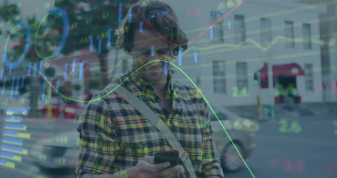 Man in City Using Smartphone with Overlaid Business Data Analysis