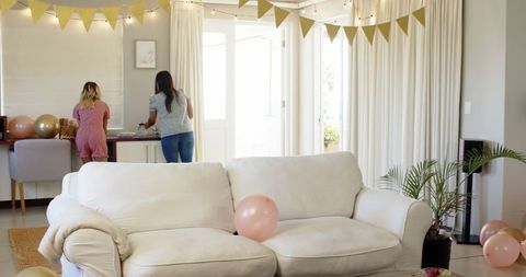 Women Preparing Stylish Home for Festive Birthday Celebration