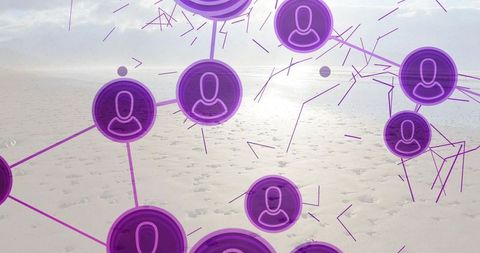 Floating purple user nodes connecting over coastal sand under soft horizon light