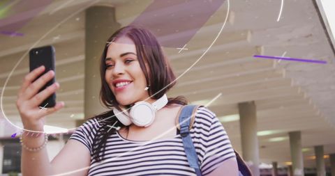 Smiling Woman Using Smartphone with Digital Processing Overlays