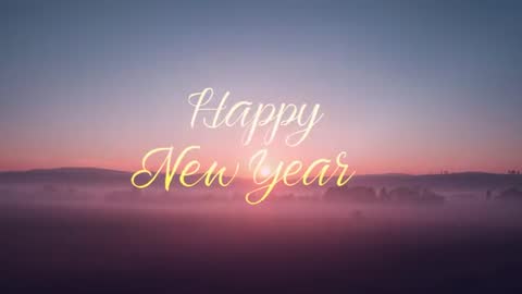 Sunrise Fog Greeting Video Glowing Cursive Happy New Year Text Over Misty Valley
