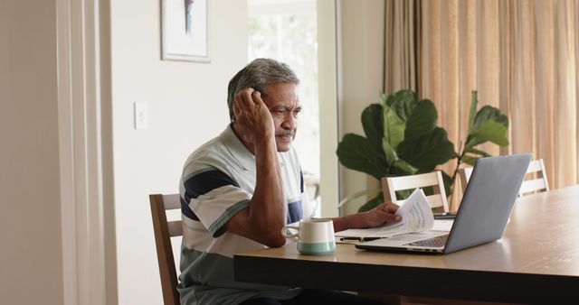 Elderly Man Analyzing Financial Documents at Home - Download Free Stock Images Pikwizard.com