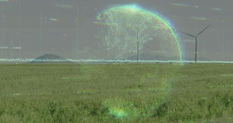 Holographic sphere in grassland with wind turbines