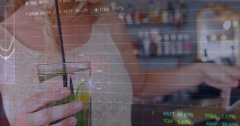 Businesswoman Analyzing Stock Data While Enjoying Beverage