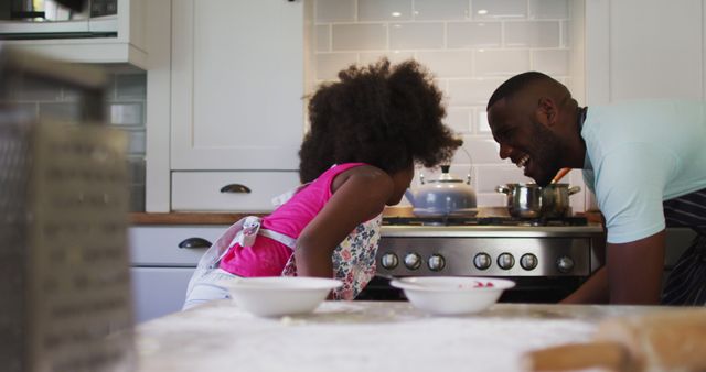 Father and Daughter Cooking Together and High-Fiving in Modern Home Kitchen - Download Free Stock Images Pikwizard.com