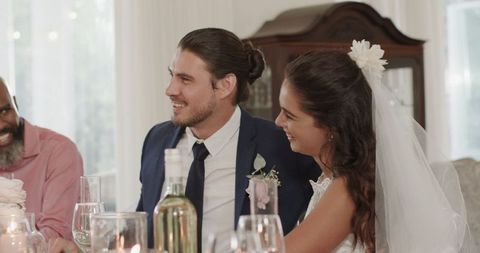 Bride and Groom Sharing Joyful Moment at Wedding Reception