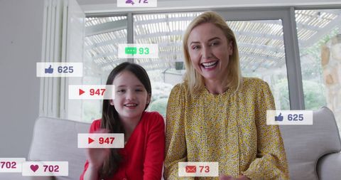 Mother and Daughter Enjoy Social Media Interaction at Home