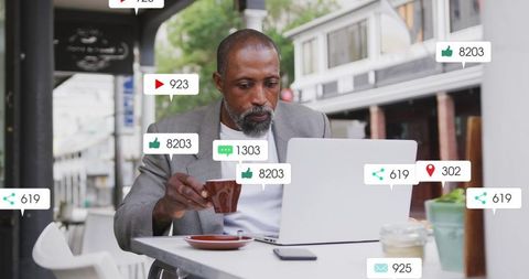 Businessman Analyzing Social Media at Outdoor Cafe