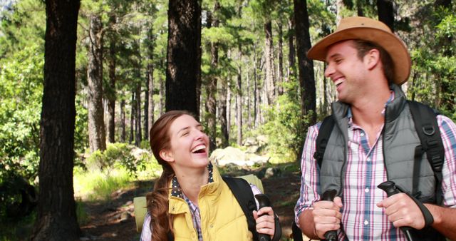 Happy Couple Hiking in a Forest on a Sunny Day - Download Free Stock Images Pikwizard.com