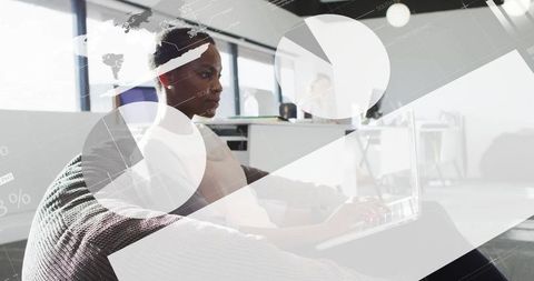 Focused Woman Typing on Laptop in Modern Office Environment