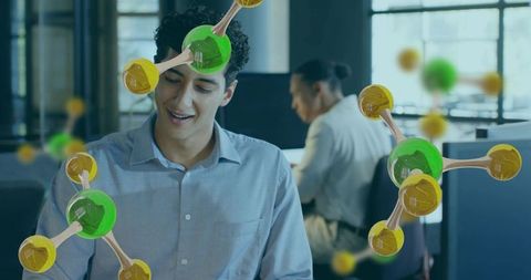 Young professional reading in modern open office with molecular ar overlays for biotech