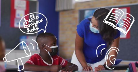 Teacher Guiding Student in Classroom with Digital Tools