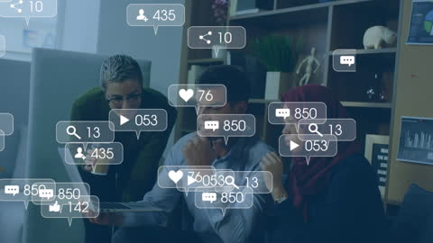 Business Team Engaging with Social Media in Office