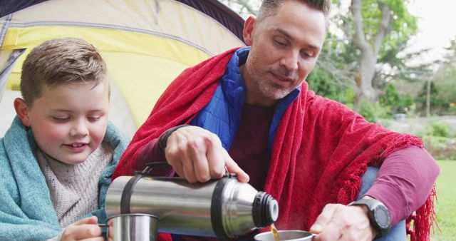 Caucasian Father and Son Enjoying Outdoor Tea Break in Tent - Download Free Stock Images Pikwizard.com