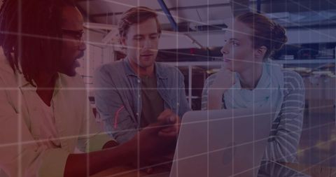 Diverse Team Collaborating on Technology Project in Modern Office