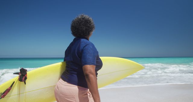 Senior Woman with Surfboard Standing on Beach - Download Free Stock Images Pikwizard.com