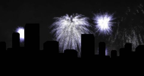 White christmas fireworks over cityscape night silhouette