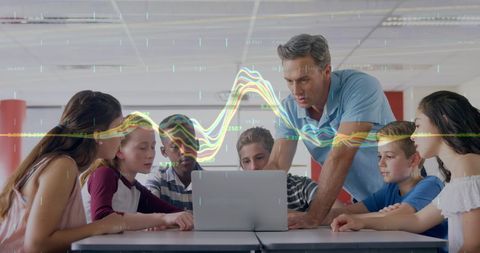 Engaged Teacher Guiding Diverse Students with Technology and Financial Data - Download Free Stock Images Pikwizard.com