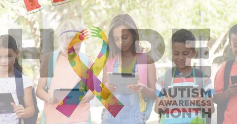 Children sharing electronic devices for autism awareness month