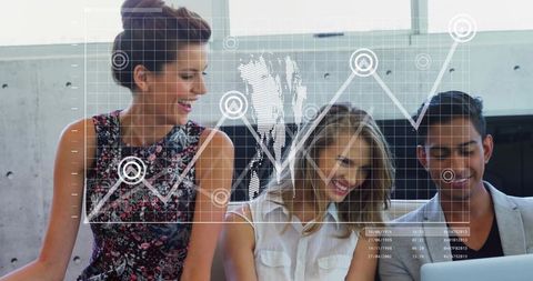 Young Professionals Collaborating on Interactive Data Visualization in Office Lounge