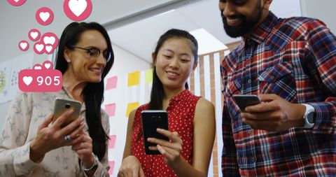 Team Engaging with Social Media in Office Environment