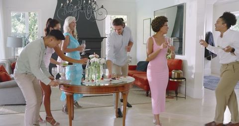 Friends Enjoying Pre-Wedding Celebration in Modern Kitchen