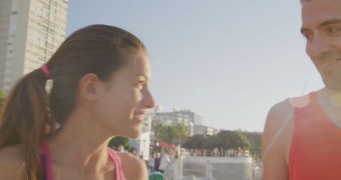 Joyful Couple Enjoying Outdoor Exercise in Sunny Park