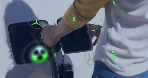 Woman Connecting Electric Vehicle Charger with Augmented Reality Green Icons for Eco Charging