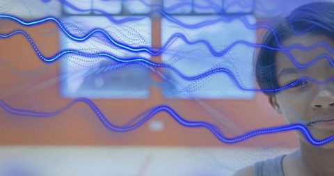 Boy Observing Blue Digital Waves in Futuristic Environment