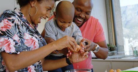 Happy Family Baking Together in Bright Home Kitchen