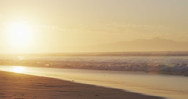 Serene Sunrise Over Quiet Beach Golden Sands Peaceful Waves - Download Free Stock Photos Pikwizard.com