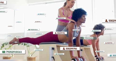 Pilates instructor assisting client on wooden pilates chair with wearable fitness data overlays