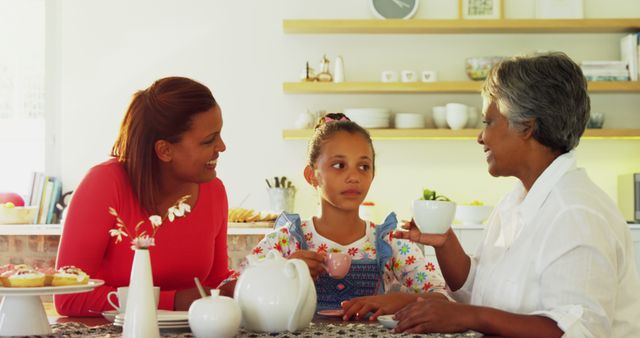 Multigenerational Family Enjoying Tea Time in Bright Kitchen - Download Free Stock Images Pikwizard.com