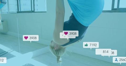 Athletic woman practicing aerial yoga swing with social media elements