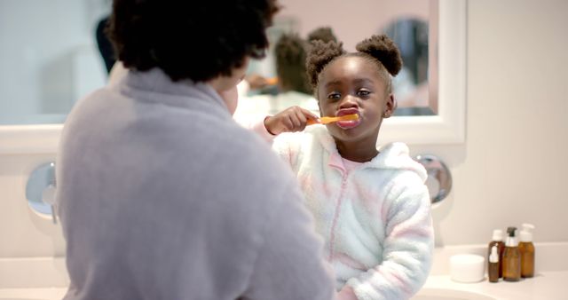 Mother Helping Daughter Brush Teeth Morning Routine - Download Free Stock Images Pikwizard.com