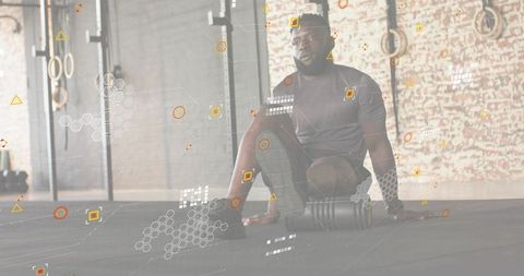 Rolling athlete using foam roller in industrial gym with hud overlay for mobility recovery