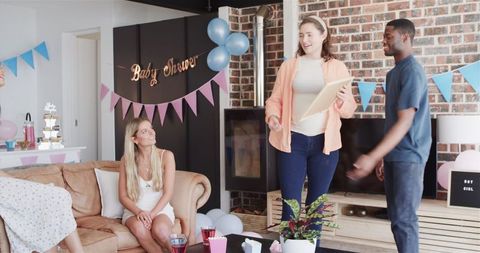 Diverse Friends Enjoying Baby Shower with Games and Decorations