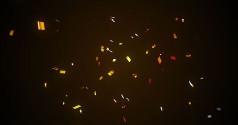 Colorful Confetti Falling Against Dark Background