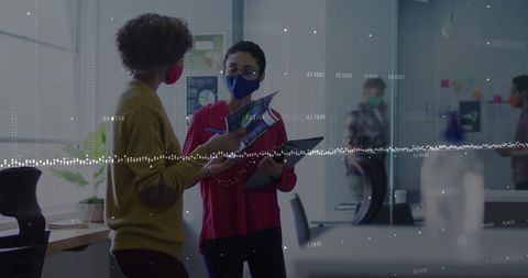 Diverse Colleagues Discussing Data Analytics at Office