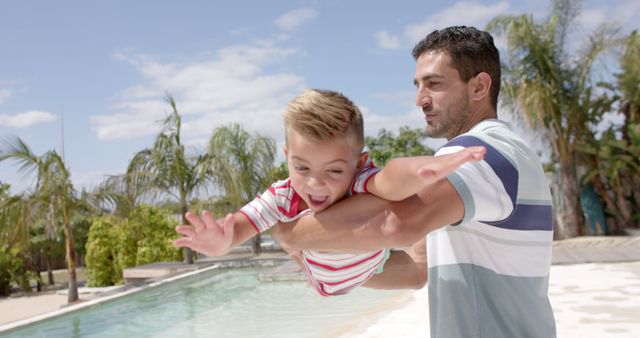 Father and Son Playing by Pool on Sunny Summer Day - Download Free Stock Images Pikwizard.com