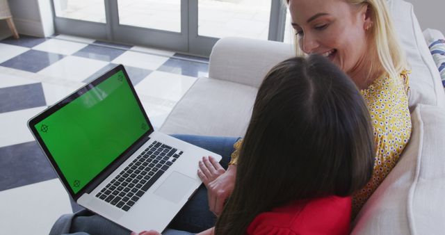 Mother and Daughter Using Laptop with Green Screen at Home - Download Free Stock Images Pikwizard.com