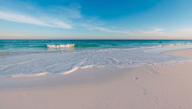 Turquoise Tide Washing Pale Sand Beach at Tranquil Horizon during Soft Light