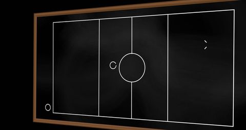 Chalk-drawn soccer strategy outline on blackboard