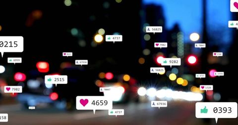 Floating social media reaction bubbles hovering over blurred city traffic at night