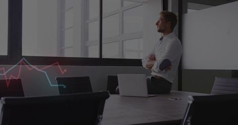 Business Executive Analyzing Data at Modern Conference Table